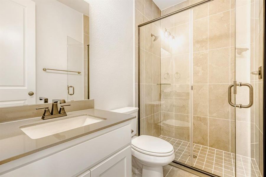 Bathroom with vanity and a stall shower