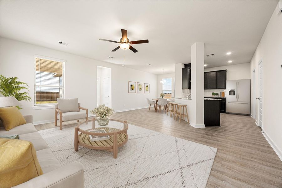 Sunlight fills this open living space, showcasing a modern, neutral design and recessed lighting. The layout flows smoothly into the kitchen and dining areas, creating a bright, inviting environment perfect for relaxing or entertaining. Sunlight fills this open living space, showcasing a modern, neutral design and recessed lighting. The layout flows smoothly into the kitchen and dining areas, creating a bright, inviting environment perfect for relaxing or entertaining.