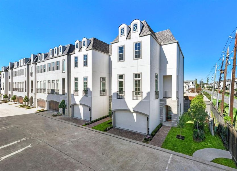 Three story 3 bedroom modern open concept living and dining is a must see! Model home is on the right in picture and one of several available Jamye plans on the left at 11104 Savannah Oaks Ln.