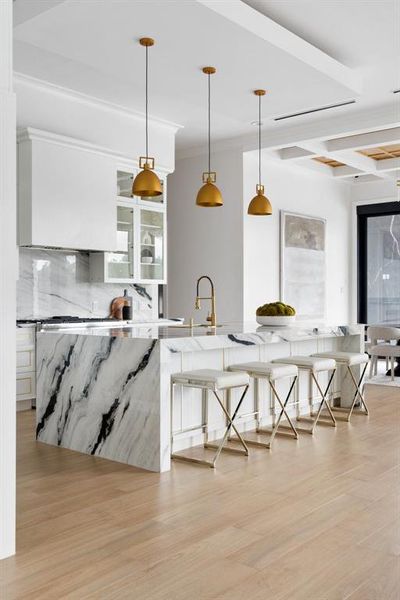 Step into a designer kitchen so effortlessly chic and elegant, it's almost too beautiful to even think about cooking in.