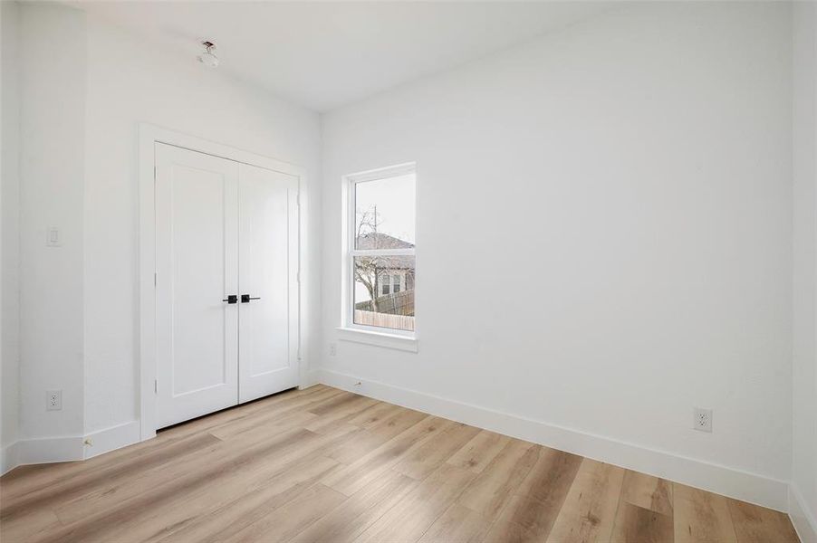 Empty room featuring light wood-type flooring