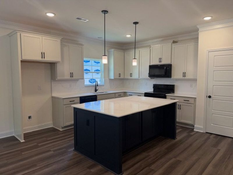 Furnished interior view inside a new home in Royal Pines, Trinity (Image 6).