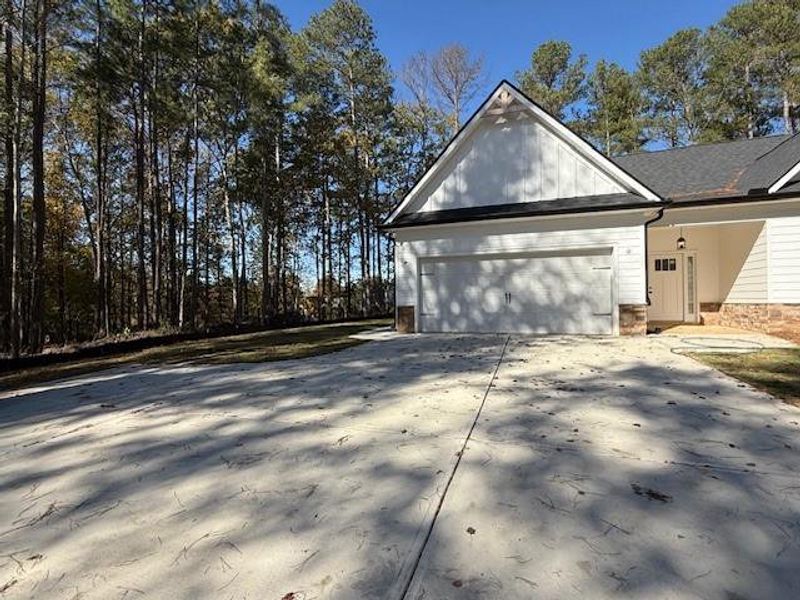Front exterior of a new home in , Rockmart, GA, highlighting curb appeal (Image 10).