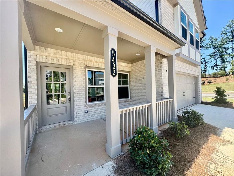 Exterior details and patio area of a home in Eastlyn Crossing, Flowery Branch (Image 4).