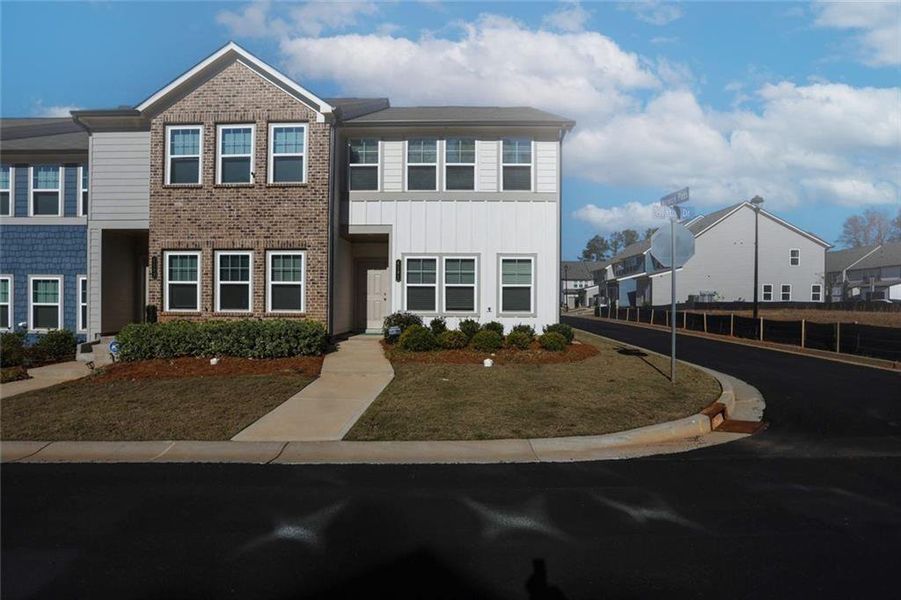 Front exterior of a new home in Laurelwood, Douglasville, GA, highlighting curb appeal (Image 28).