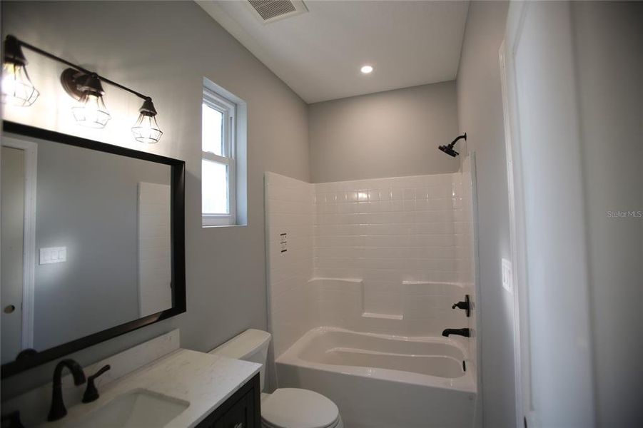 Bathroom that has access from living room and 2nd bedroom