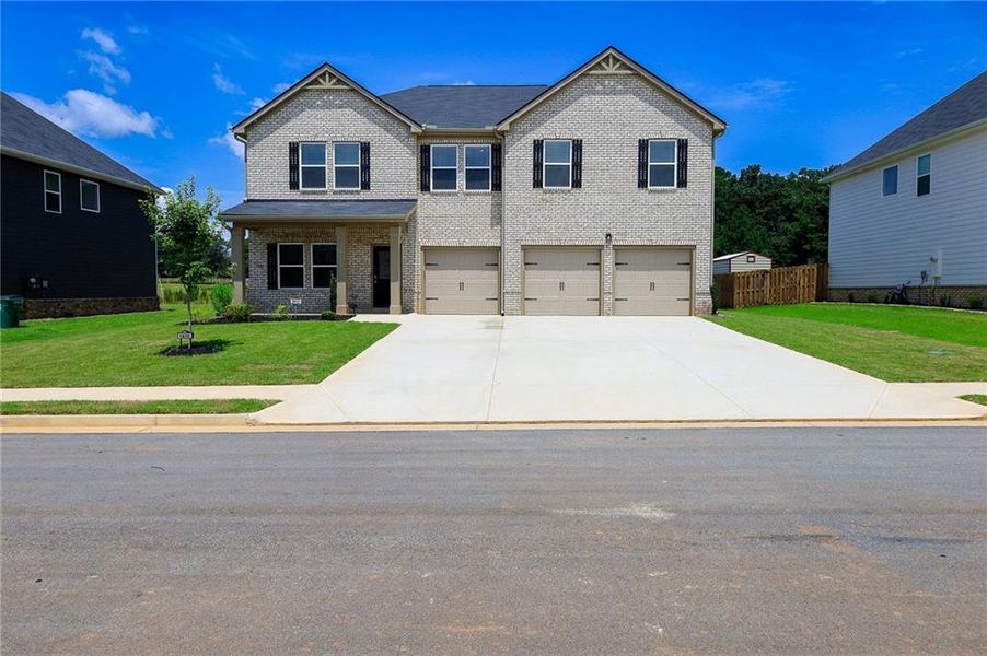 Front exterior of a new home in , McDonough, GA, highlighting curb appeal (Image 27).