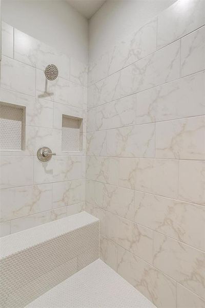 Bathroom with tiled shower