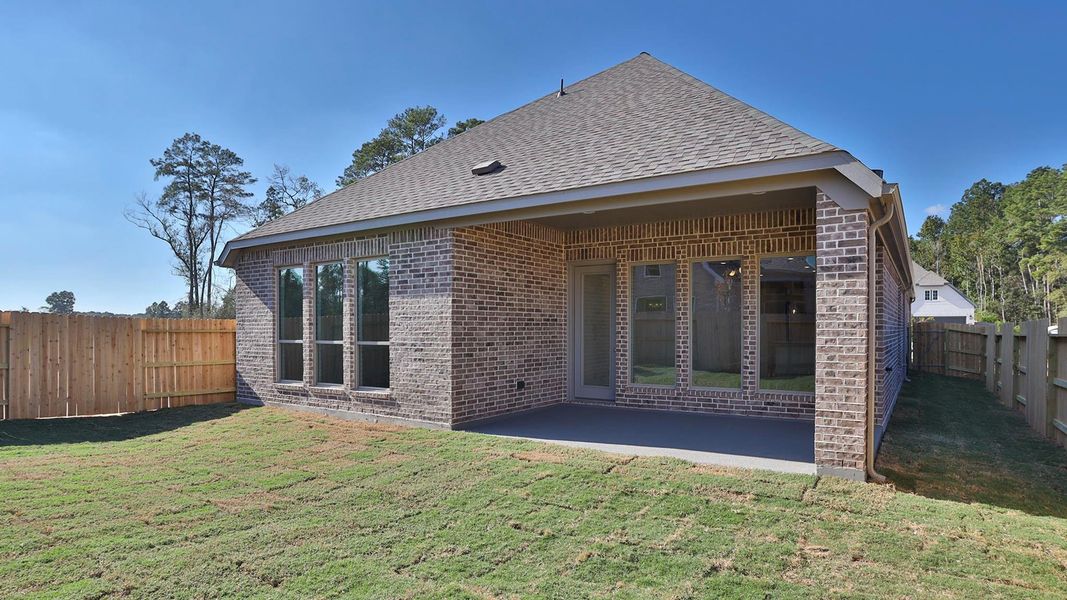 Exterior details and patio area of a home in Artavia 45', Conroe (Image 3).