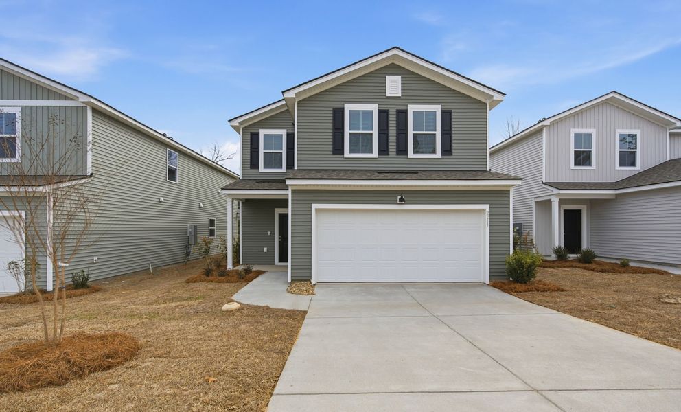 Front exterior of a new home in Grand Arbor, Blythewood, SC, highlighting curb appeal (Image 19).