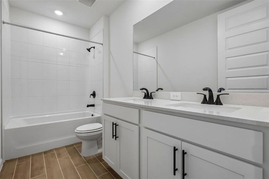 Furnished interior view inside a new home in The Grove at Stuart Crossing - Signature Series, Bartow (Image 13).