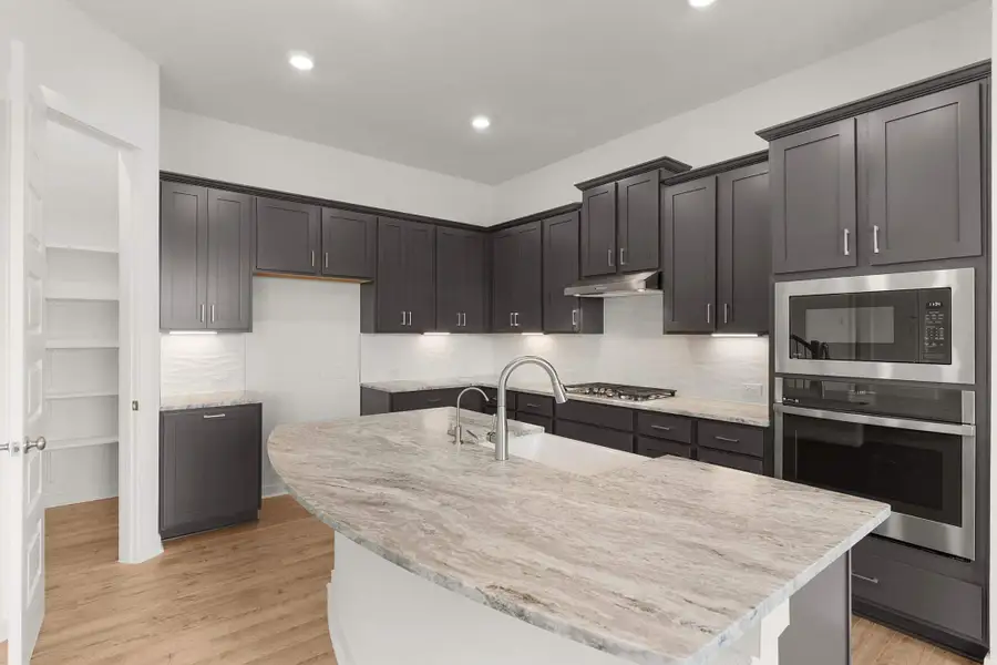 Furnished interior view inside a new home in The Grove at Blackhawk, Pflugerville (Image 5). Furnished interior view inside a new home in The Grove at Blackhawk, Pflugerville (Image 5).