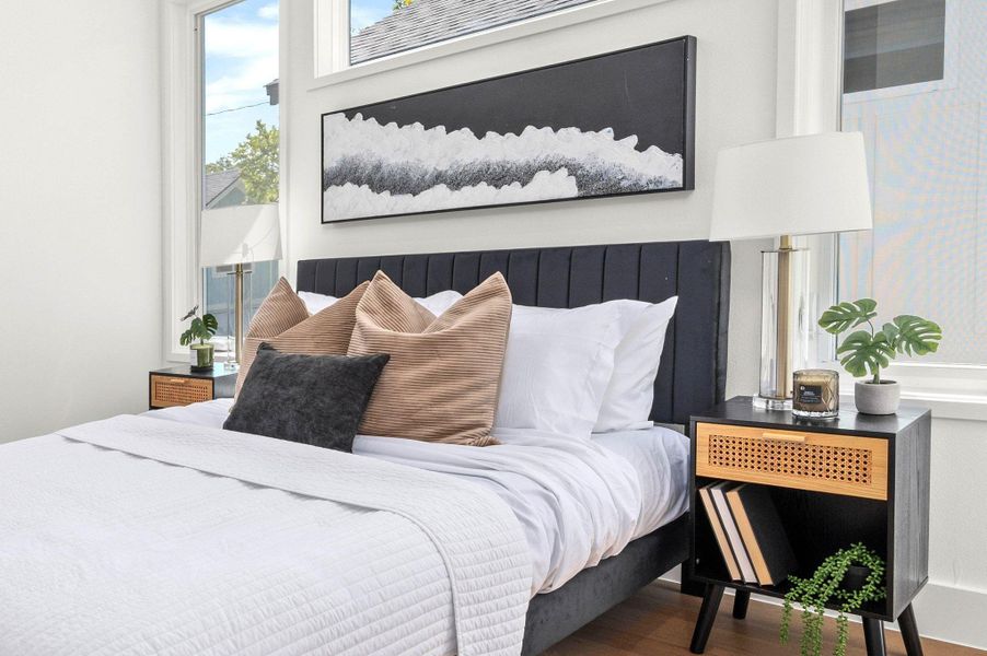 Bedroom featuring wood finished floors Bedroom featuring wood finished floors