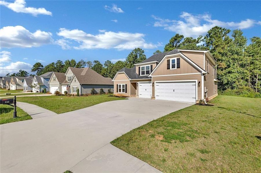 Front exterior of a new home in , Macon, GA, highlighting curb appeal (Image 26).