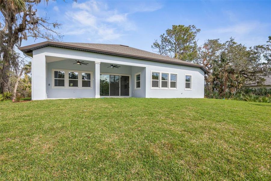 Exterior details and patio area of a home in Palm Coast Plantation, Palm Coast (Image 33).