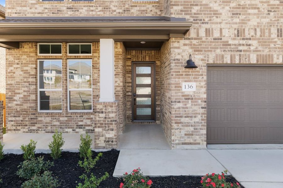 Exterior details and patio area of a home in Park Collection at Lariat, Liberty Hill (Image 3).