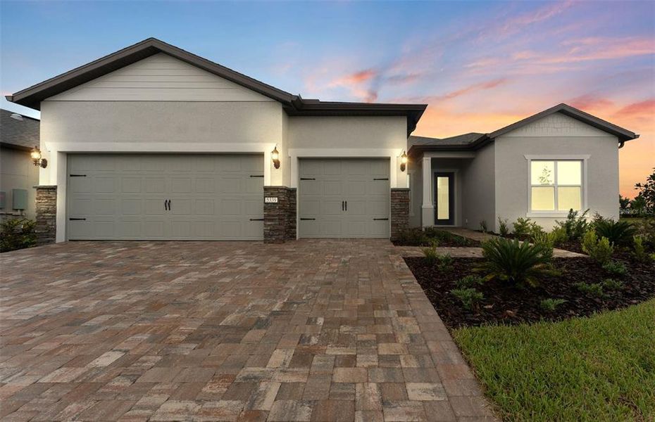 Front exterior of a new home in Del Webb Stone Creek, Ocala, FL, highlighting curb appeal (Image 1).