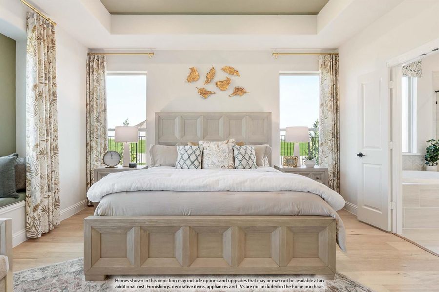 Master bedroom with tray ceiling, wood-frame bed, hardwood floors, and two windows with patterned curtains