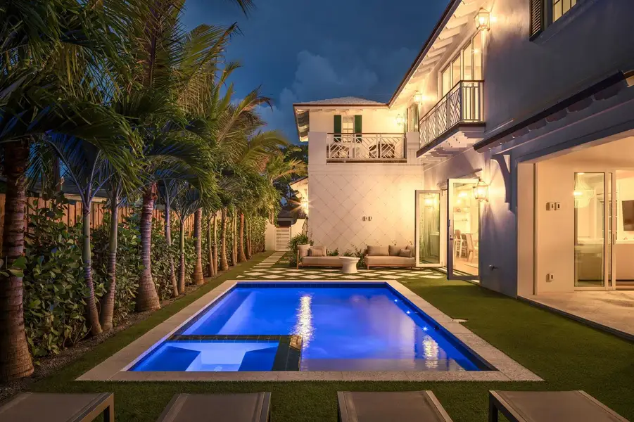 11 - Blue-lit pool with integrated spa a