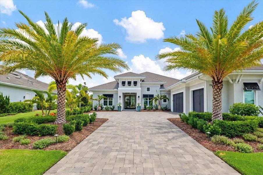 Front exterior of a new home in , Lakewood Ranch, FL, highlighting curb appeal (Image 1). Front exterior of a new home in , Lakewood Ranch, FL, highlighting curb appeal (Image 1).