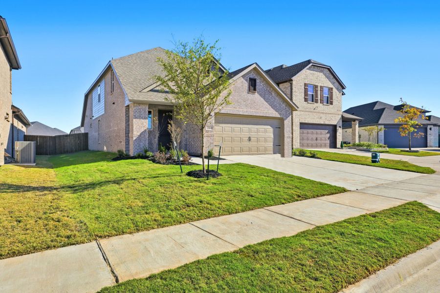 Front exterior of a new home in Elevon, Lavon, TX, highlighting curb appeal (Image 26).