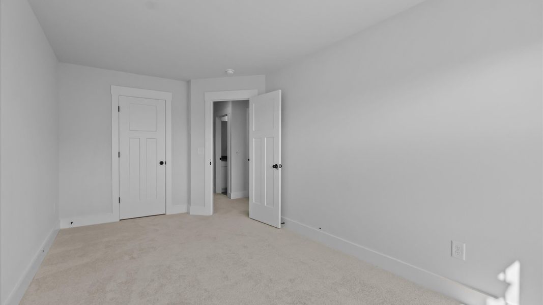 First-rate secondary bedroom with a spacious walk-in closet and elegant carpeted flooring First-rate secondary bedroom with a spacious walk-in closet and elegant carpeted flooring
