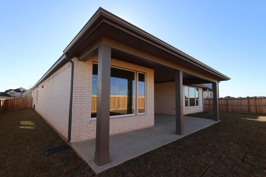 Exterior details and patio area of a home in Dunham Pointe, Cypress (Image 19).