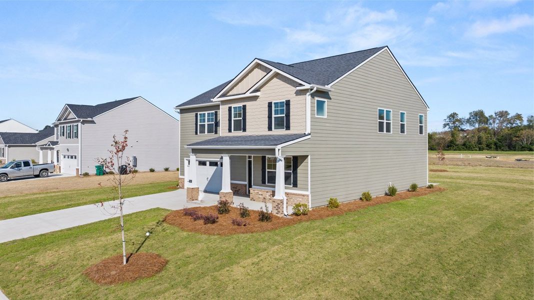 Front exterior of a new home in Southwind Village, Evans, GA, highlighting curb appeal (Image 2).
