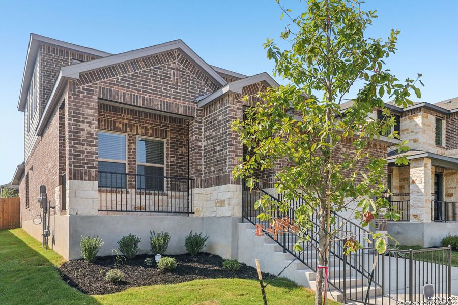 Front exterior of a new home in Comanche Ridge, San Antonio, TX, highlighting curb appeal (Image 1). Front exterior of a new home in Comanche Ridge, San Antonio, TX, highlighting curb appeal (Image 1).