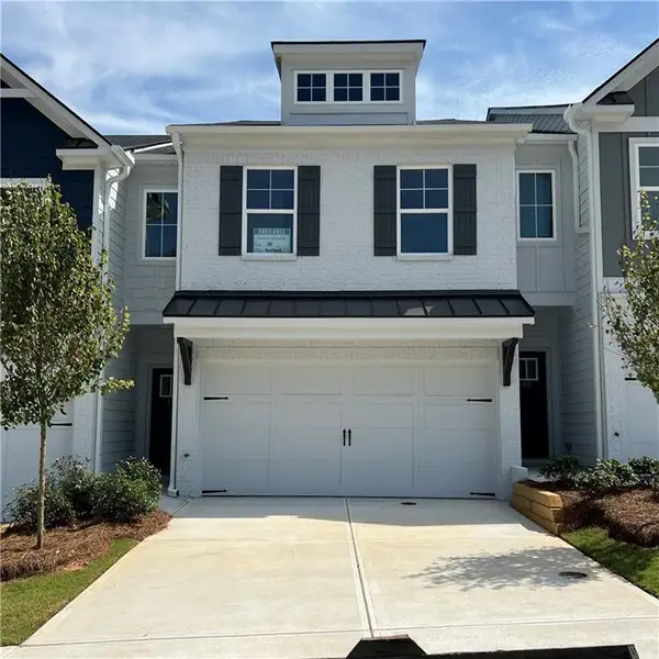 Front exterior of a new home in Old Salem Crossing, Conyers, GA, highlighting curb appeal (Image 1). Front exterior of a new home in Old Salem Crossing, Conyers, GA, highlighting curb appeal (Image 1).