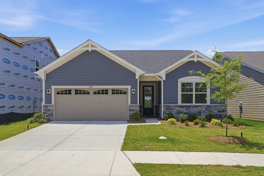 Front exterior of a new home in Westfall, Gastonia, NC, highlighting curb appeal (Image 1). Front exterior of a new home in Westfall, Gastonia, NC, highlighting curb appeal (Image 1).