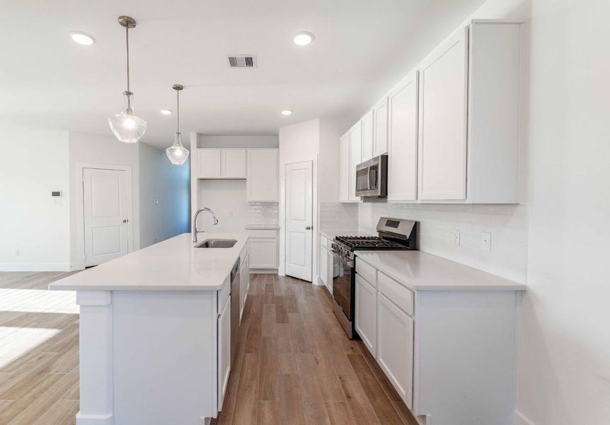 Furnished interior view inside a new home in Massey Oaks, Pearland (Image 12). Furnished interior view inside a new home in Massey Oaks, Pearland (Image 12).