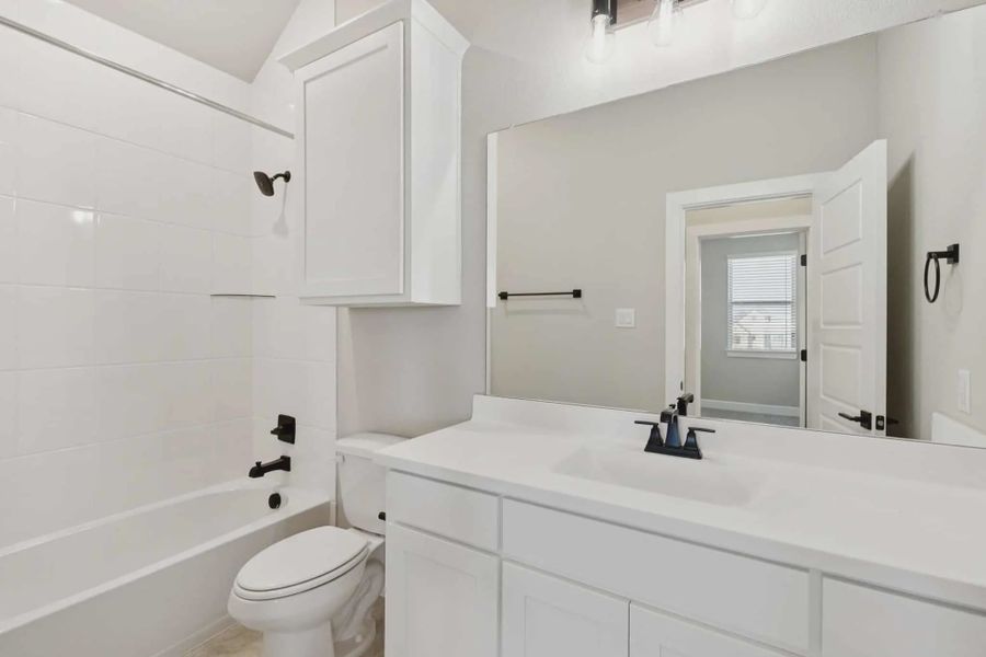 Representative furnished interior of a home built from the Windcrest by Chesmar Homes in Talia, Mesquite (Image 12).