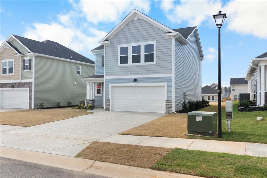 Front exterior of a new home in Windsor, North Augusta, SC, highlighting curb appeal (Image 17).