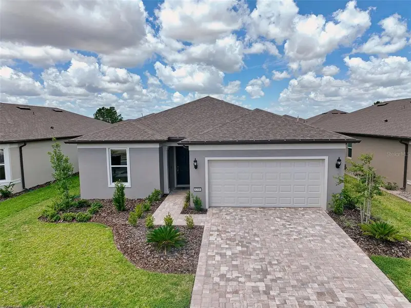 Front exterior of a new home in , Ocala, FL, highlighting curb appeal (Image 2).