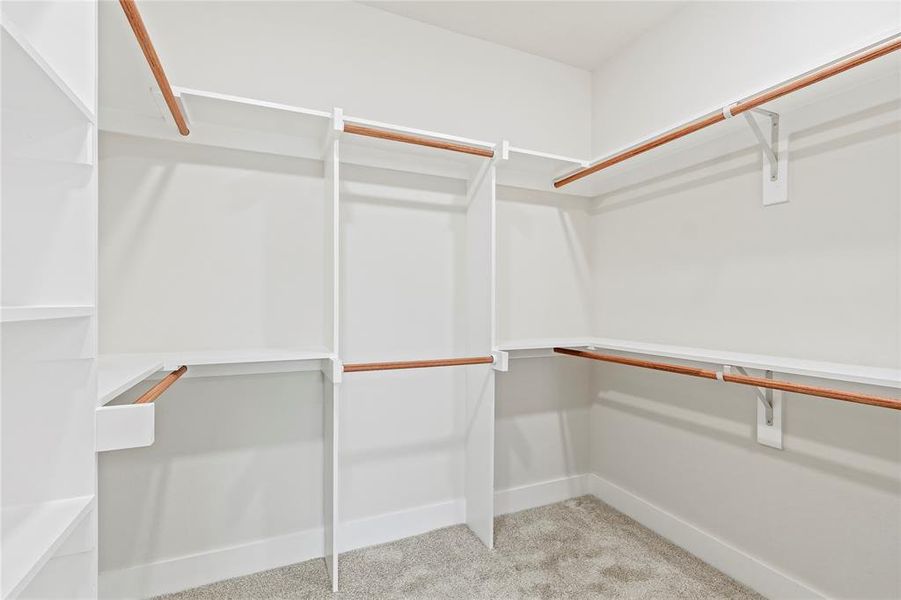 Walk in closet with light carpet Walk in closet with light carpet