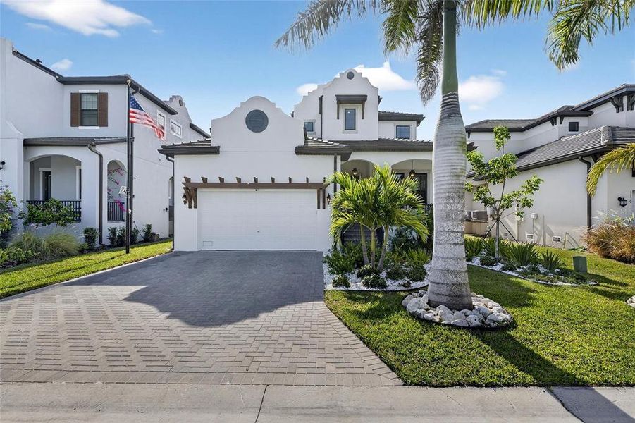 Front exterior of a new home in SouthShore Yacht Club: Somerset Preserve, Ruskin, FL, highlighting curb appeal (Image 24).