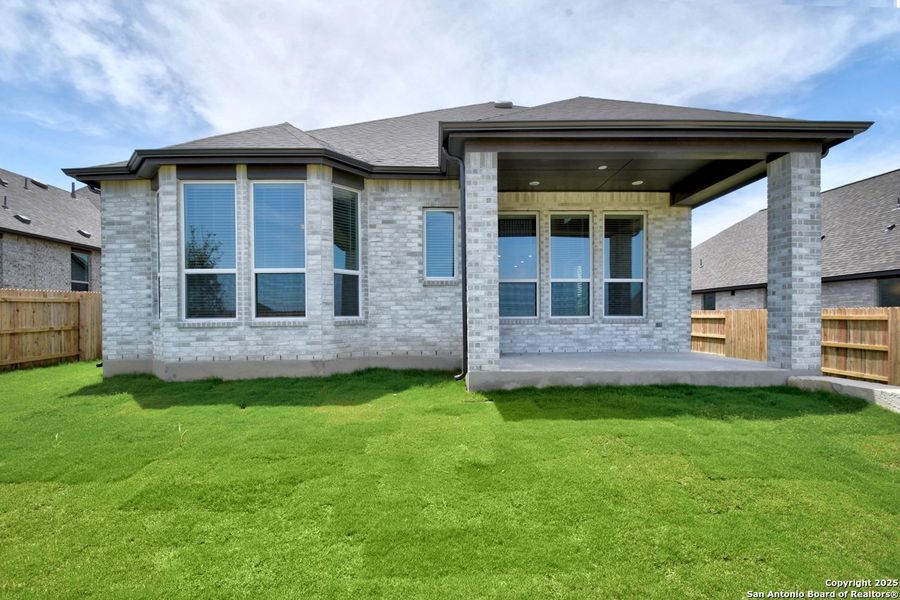 Front exterior of a new home in Homestead, Schertz, TX, highlighting curb appeal (Image 2).