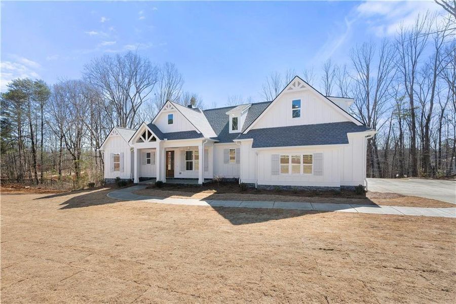 Front exterior of a new home in , Ball Ground, GA, highlighting curb appeal (Image 27). Front exterior of a new home in , Ball Ground, GA, highlighting curb appeal (Image 27).