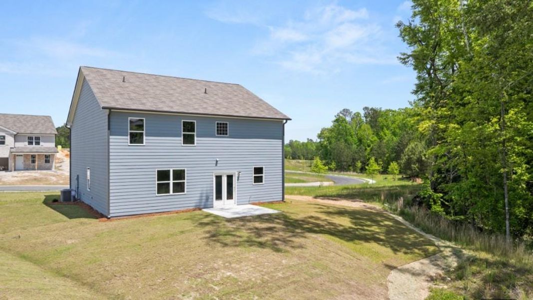 Exterior details and patio area of a home in Northwoods at Mirror Lake, Villa Rica (Image 3).