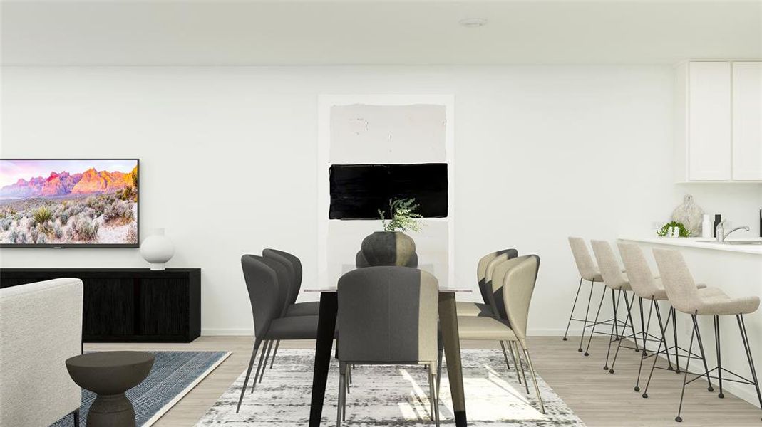 Dining space featuring light hardwood / wood-style flooring and sink