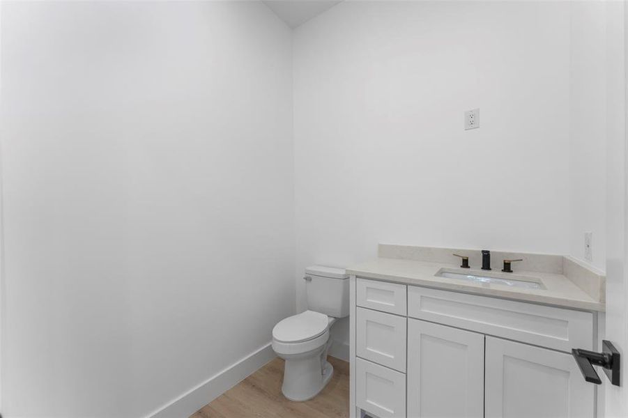 Bathroom with vanity and light wood-type flooring