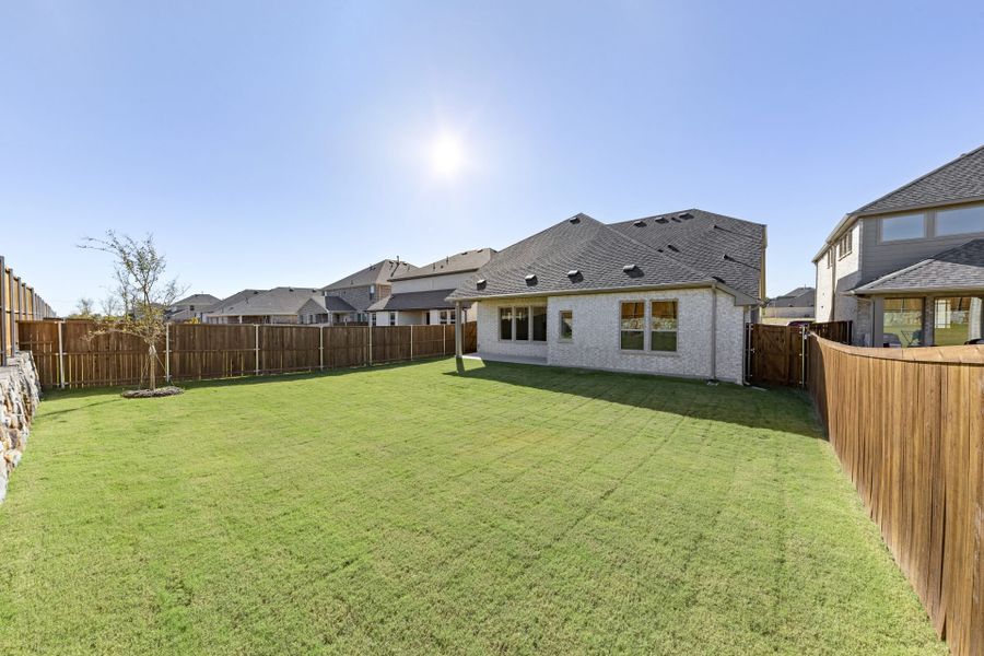 Exterior details and patio area of a home in Meadow Run, Melissa (Image 17). Exterior details and patio area of a home in Meadow Run, Melissa (Image 17).