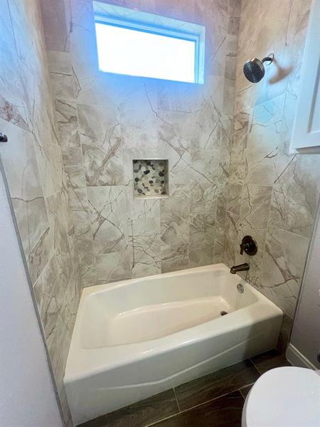 Custom tile work in guest tub/shower