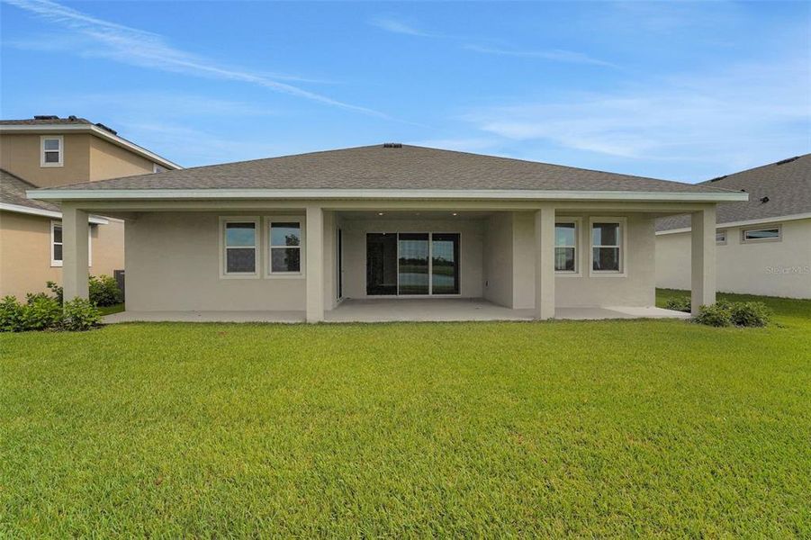 Front exterior of a new home in Seaire, Parrish, FL, highlighting curb appeal (Image 20).