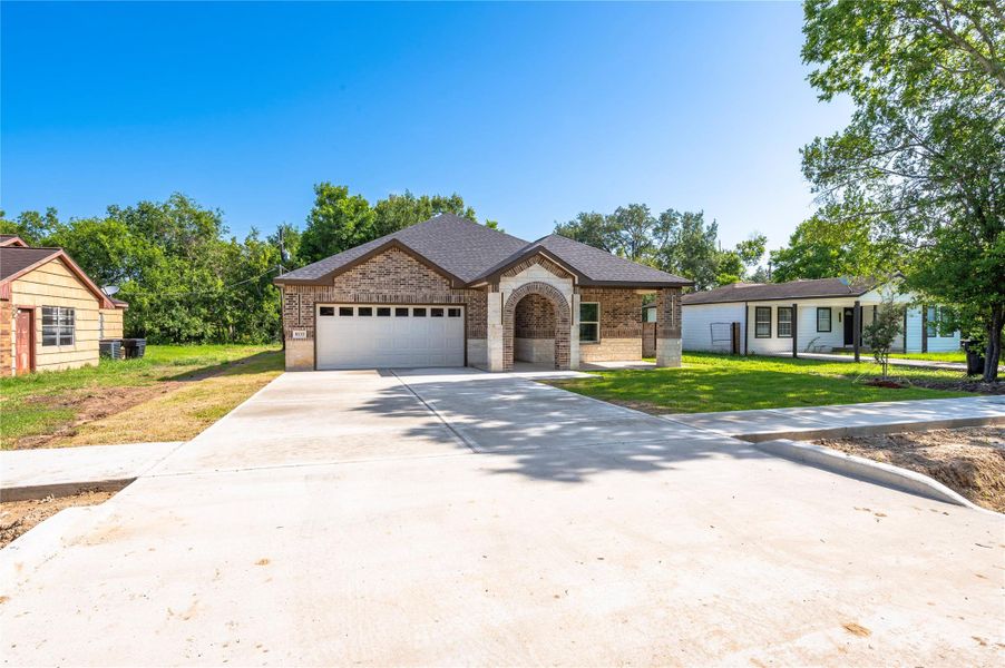 Front exterior of a new home in , Houston, TX, highlighting curb appeal (Image 24).