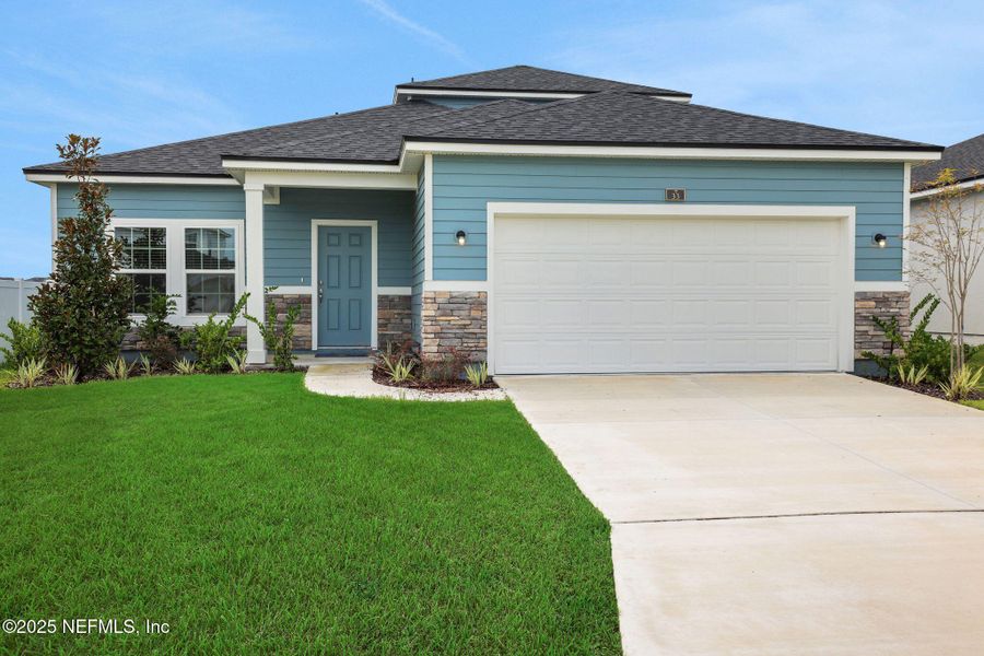 Front exterior of a new home in Cordova Palms, St. Augustine, FL, highlighting curb appeal (Image 20).