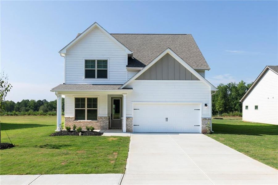 Front exterior of a new home in Mount Tabor Pointe, Dallas, GA, highlighting curb appeal (Image 2).
