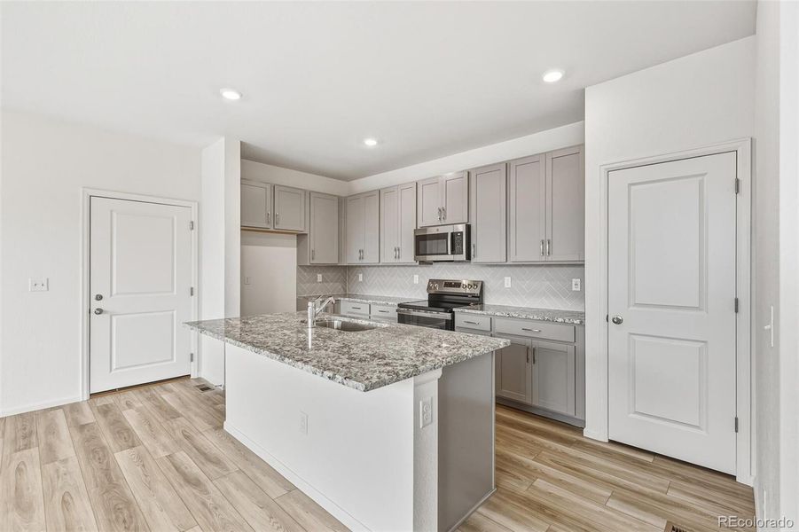 Furnished interior view inside a new home in Sky Ranch Villas, Watkins (Image 8).