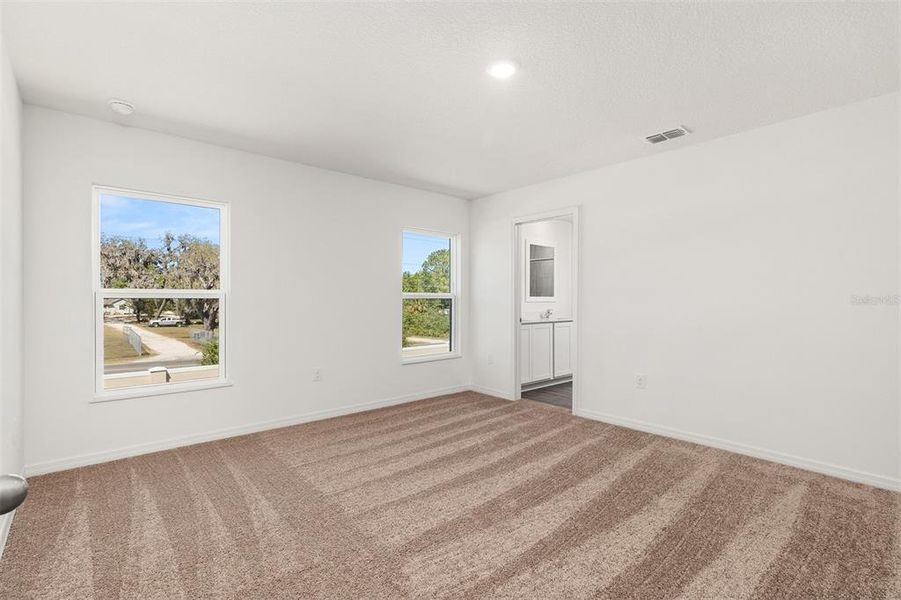 Spacious, unfurnished interior of a new home in Peach Crossings, Winter Haven (Image 21).